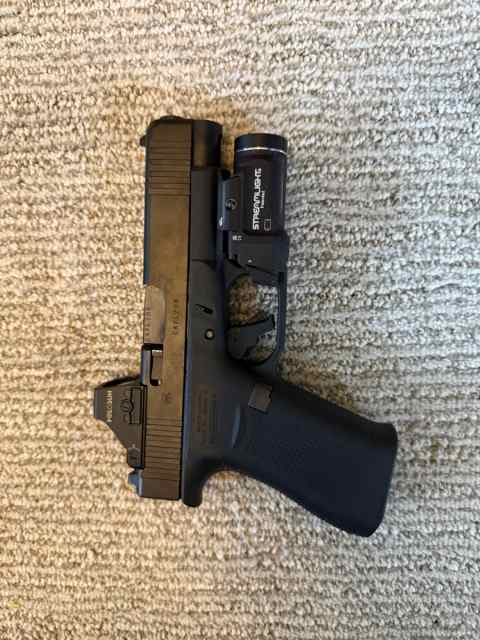 Glock 48 with red dot, light, holster, trigger